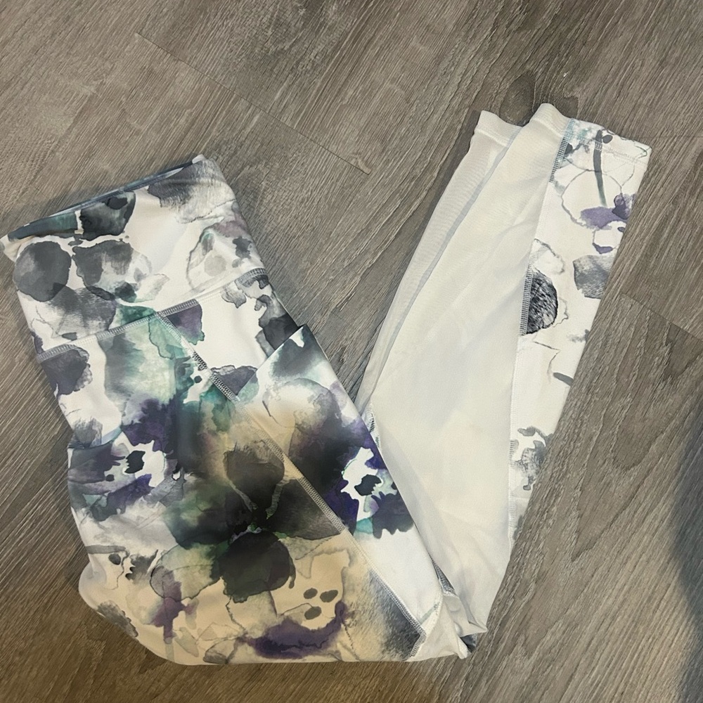 Athleta Abstract Print Leggings size medium with mesh on the legs